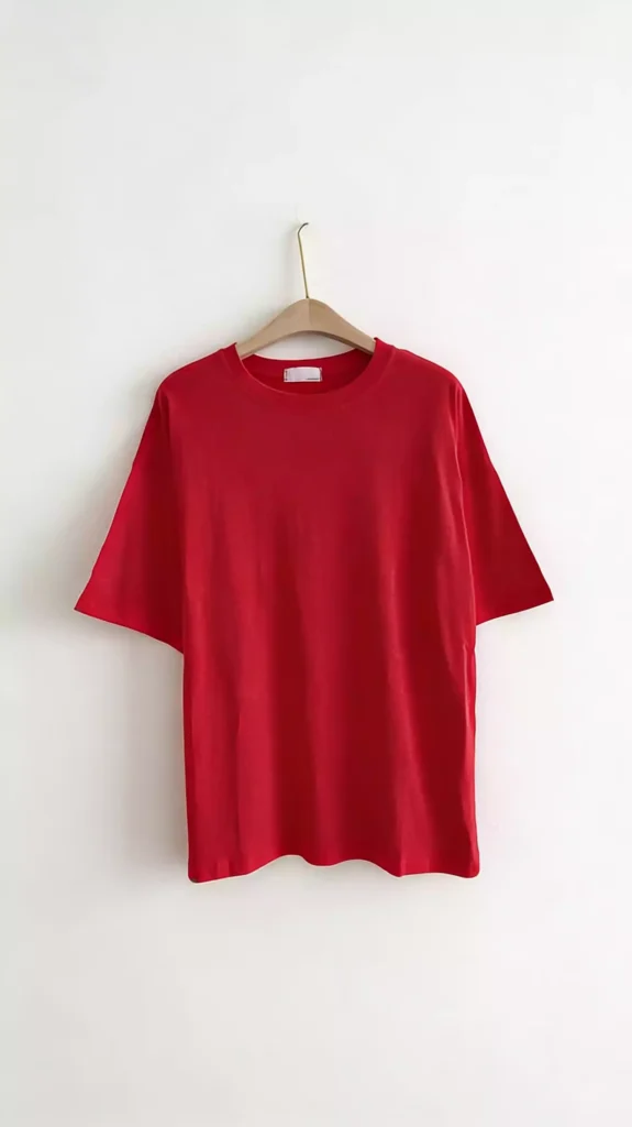 A plain bright red crew-neck short-sleeve t-shirt displayed on a hanger.