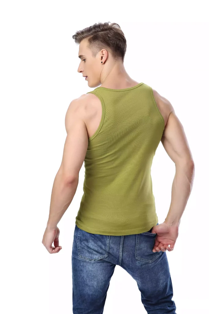 A male model seen from the back, wearing a fitted olive green cotton tank top and blue jeans, showcasing the shirt's cut and fit.