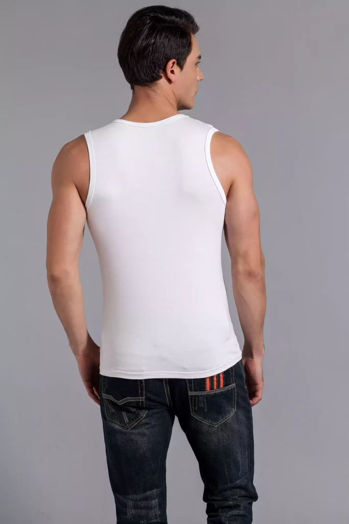 Back view of a man wearing a white tank top undershirt, showcasing the clean fit and tailored design against a grey studio background.