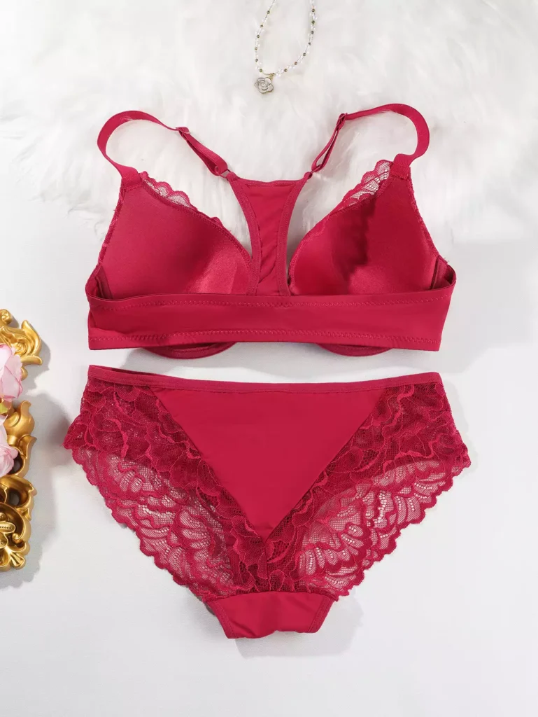 Back view of a red lace lingerie set featuring a racerback bra design and matching lace panties.